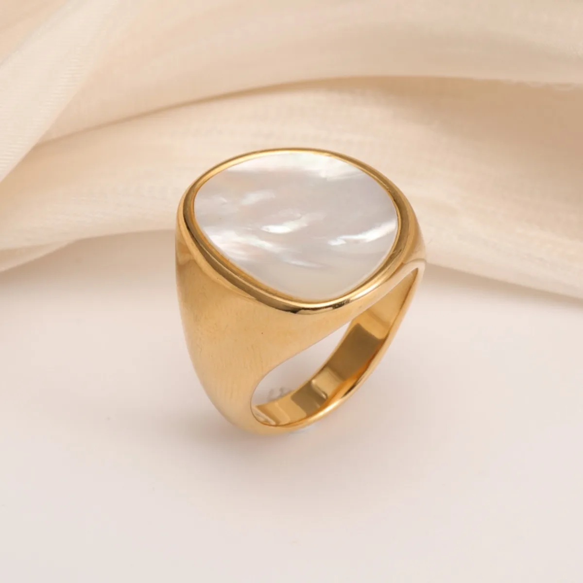 fashionable gold mother of pearl ring eye catching accessory for stylish outfits